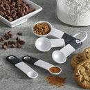A set of five white plastic measuring spoons with the following approximate sizes: 1 tablespoon, 1/2 tablespoon, 1 teaspoon, 1/2 teaspoon, 1/4 teaspoon.
