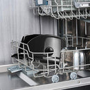 Stainless steel slow cooker with black lid and control dial.