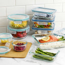 Packaged Snapware Total Solution glass food storage container, showing the brand, Pyrex compatibility, and key features like the USA origin and write & erase lid.