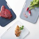 Compact set of three Joseph Joseph cutting boards with a space-saving design and metal handles.