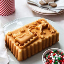 loaf shaped like Santa's sleigh with reindeer, shown on a white table