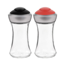 Trudeau set of two small red and black salt and pepper pop table shakers with clear bodies and colorful lids on a white background.