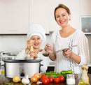 Stainless steel slow cooker with black lid and control dial.