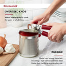 Red handled KitchenAid can opener with a silver cutting mechanism and bottle opener.