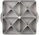 A Nordic Ware Procast Mini Scone Pan with 16 triangular cavities shown on a white background.