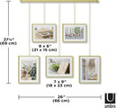 Umbra Exhibit photo display with five hanging frames (two 4x6 and three 5x7) suspended from a brushed metal ledge, on a white background.