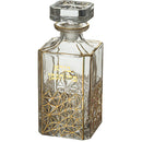  Clear crystal wine bottle with gold embossed Hebrew letters on a white background.