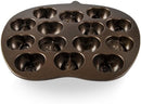 Nordic Ware cast aluminum apple slice cakelet pan with 14 nonstick cavities shaped like apple slices, shown on a white background.