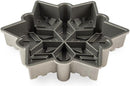  Nordic Ware cast aluminum snowflake-shaped baking pan with intricate detailing, shown on a white background.