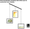 A modern black frame photo display featuring three frames suspended from a horizontal bar by thin rods.