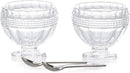 Elegant Godinger salt and pepper cellars with matching spoons on a white background.