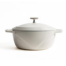 Beautiful white Dutch oven with excellent heat retention, featuring a secure lid and comfortable handles.