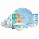 A complete 18-piece porcelain dinnerware set in an off-white color, accented with a warm saffron-toned pattern, from the Spice by Tia Mowry collection.