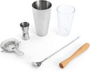 Five-piece bar tool set including stainless steel jigger, wooden muddler, stirrer, Boston shaker with glass top, and strainer on a white background.