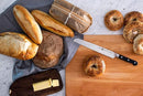 9-inch ZWILLING J.A. Henckels Z15 serrated bread knife with stainless steel blade and black POM handle, shown on a table