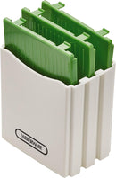 Green handheld Farberware mandoline slicer with stainless steel blade on a white background.