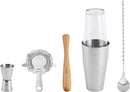 Five-piece bar tool set including stainless steel jigger, wooden muddler, stirrer, Boston shaker with glass top, and strainer on a white background.