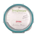Packaged Snapware Total Solution glass food storage container, showing the brand, Pyrex compatibility, and key features like the USA origin and write & erase lid.