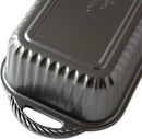 close up of the handle of the Nordic Ware Procast Classic silver loaf pan on a white background.