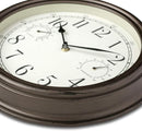 Westclox 12-inch indoor/outdoor wall clock with temperature and humidity gauges in bronze on a white background.