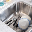 Premium Stainless Steel Kitchen Sink Grid, ideal for protecting sinks and drying dishes. This durable rack features rubberized feet and an opening for the drain, designed for easy operation and versatile kitchen preparation.