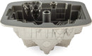 Nordic Ware silver gingerbread house Bundt pan with detailed holiday-themed mold on a white background.