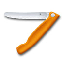 Victorinox foldable serrated knife with an orange handle and stainless steel blade, displayed on a white background.