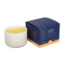 Trapp No. 4 Orange Vanilla 3.75 oz. Small Poured Candle in a frosted white glass container, placed next to its signature navy and orange packaging.