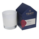 Trapp No. 24 Wild Currant 7 oz. House Box Candle in a frosted white glass container, placed next to its signature navy and red house-shaped packaging.