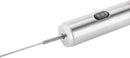 Angled view of the frother’s stainless steel body and slim whisk attachment.