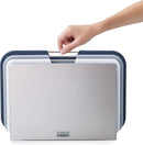 Compact set of three Joseph Joseph cutting boards with a space-saving design and metal handles.