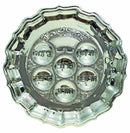 A silver-plated Passover Seder plate featuring a scalloped border, intricate detailing, and six engraved sections with Hebrew labels for the symbolic Seder items.