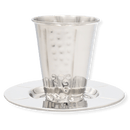 A silver Kiddush cup with a matching plate, featuring an elegant textured design and reflective finish.