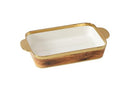 Close-up view of the dish’s gold rim and handle, highlighting its elegant details.