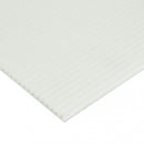 Close-up view of a white corrugated plastic sheet, showing the textured ridges and hollow fluted core.