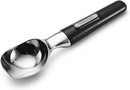 Angled view of the Farberware ice cream scoop showcasing the polished cast zinc head and black handle.