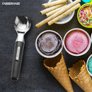 Farberware scoop surrounded by ice cream, cones, and toppings, set on a dark background.