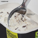 Close-up of the scoop in action digging into a container of vanilla chocolate chip ice cream.