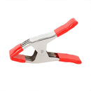 Metal spring clamp with red PVC-coated handles and jaw tips, designed for secure grip and easy handling during clamping tasks.