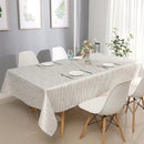70x108 rectangular tablecloth displayed on a large dining table set for six