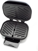 Open Dominion grill with extended drip tray for grease collection
