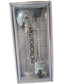 Front view of Metropolitan Salad Serving Set featuring two large serving spoons in a sleek silver finish, packaged in a clear-lid gift box.