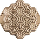 Nordic Ware toffee-colored honeycomb pull-apart Bundt pan with hexagonal cake molds on a white background.