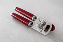 Red handled KitchenAid can opener with a silver cutting mechanism and bottle opener.