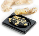 Stainless steel four-sided box grater with black handle.