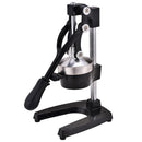 Pure black cast-iron citrus juicer with stainless steel bowl and ergonomic handle on a white background.