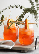 Clear, stemless wine glass with a rounded bowl shape