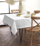 An off-white linen tablecloth with elegant drape and clean lines.