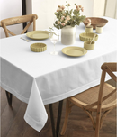 An off-white linen tablecloth with elegant drape and clean lines.