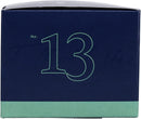 A hexagonal dark blue and light green box for a "TRAPP FRAGRANCES" candle. The box is labeled "BOB'S FLOWER SHOPPE™" with scent notes listed as "FRESH FLORALS, CUT GREEN STEMS, WATERY ACCORDS." It is a "FRAGRANCED CANDLE" weighing "3.75 oz | 106g ℮" and is identified as "No. 13".